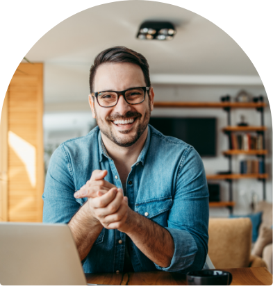 Male with laptop smiling