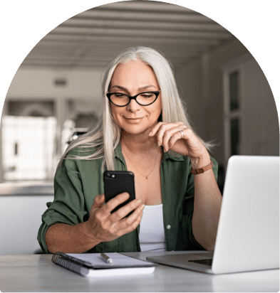 Woman with laptop and phone